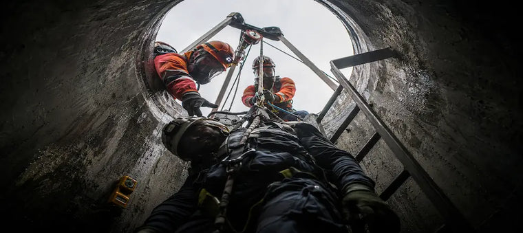 Workers performing confined space rescue.