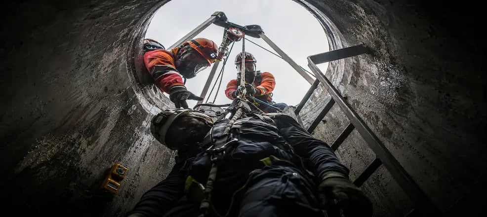 Workers performing confined space rescue.