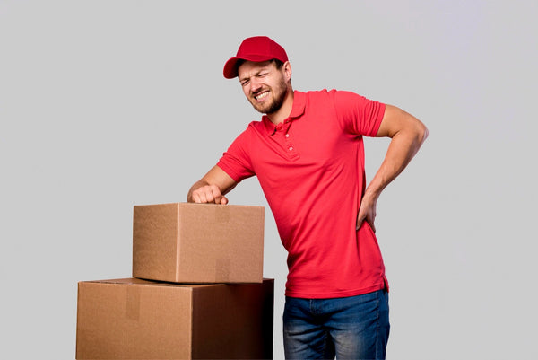 Delivery worker in red uniform holding boxes and experiencing back pain
